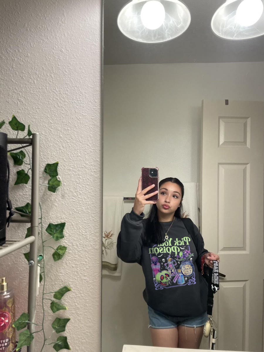 Customer wearing the same black Pick Your Poison sweatshirt